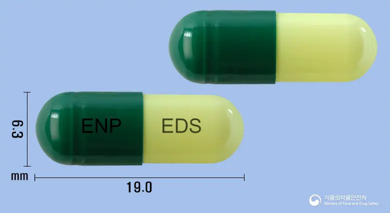 이스탄캡슐(에르도스테인) 앞뒤 사진 (초록색 캡슐, 각인 ENP EDS)