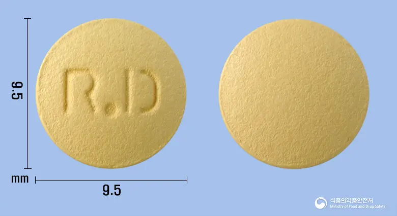 썸디정 앞뒤 사진 (주황색 원형, 각인 R.D)