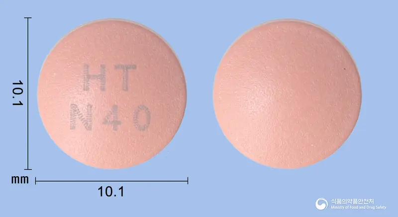 넥시메졸정40mg(에스오메프라졸마그네슘삼수화물) 앞뒤 사진 (분홍색 원형, 각인 HTN40)
