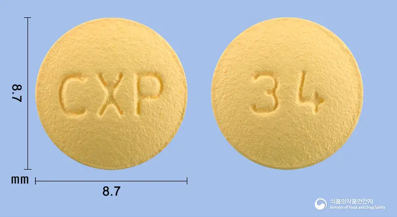 도페정10밀리그램(도네페질염산염수화물) 앞뒤 사진 (노란색 원형, 각인 CXP / 34)