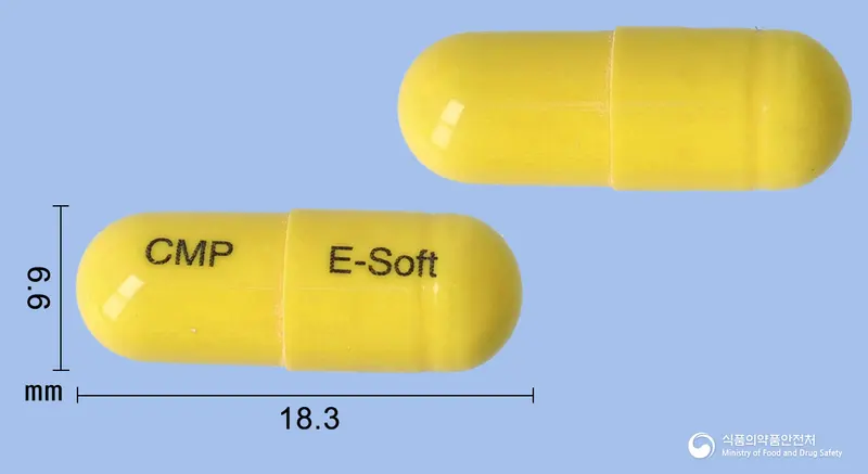 이소프트캡슐 앞뒤 사진 (노란색 캡슐, 각인 CMP E-Soft)