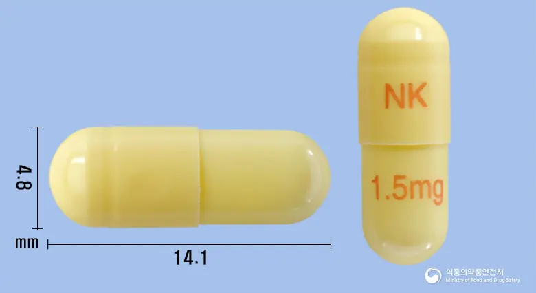 넥티민캡슐1.5밀리그램(리바스티그민타르타르산염) 앞뒤 사진 (노란색 캡슐, 각인 NK 1.5mg)