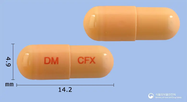 픽시마캡슐100밀리그램(세픽심수화물) 앞뒤 사진 (주황색 캡슐, 각인 DM CFX)