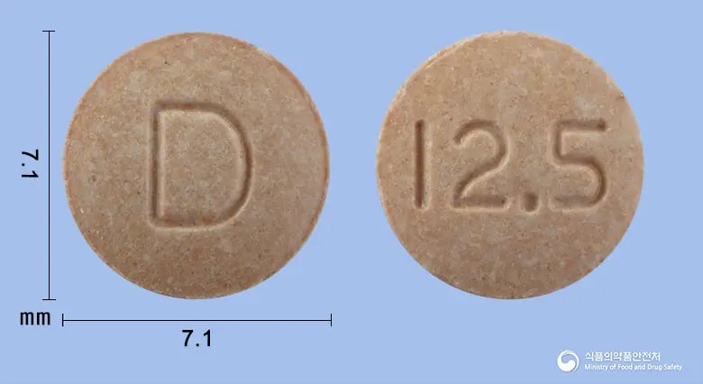 달라트정12.5mg(카르베딜롤) 앞뒤 사진 (분홍색 원형, 각인 D / 12.5)