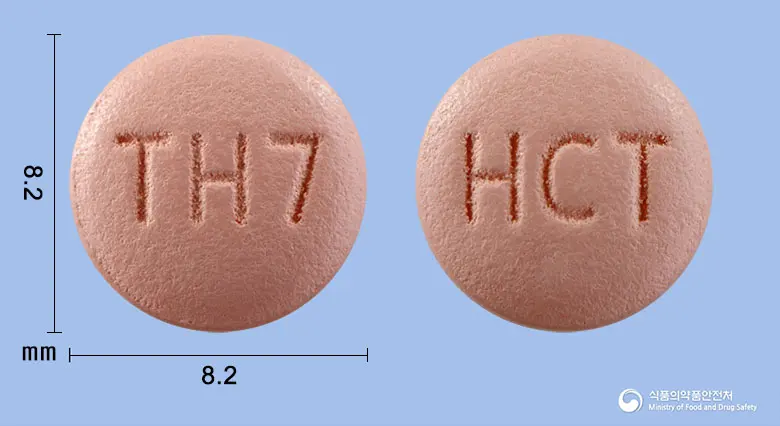 올메디퀄에이치씨티정10/40/12.5밀리그램 앞뒤 사진 (분홍색 원형, 각인 TH7 / HCT)