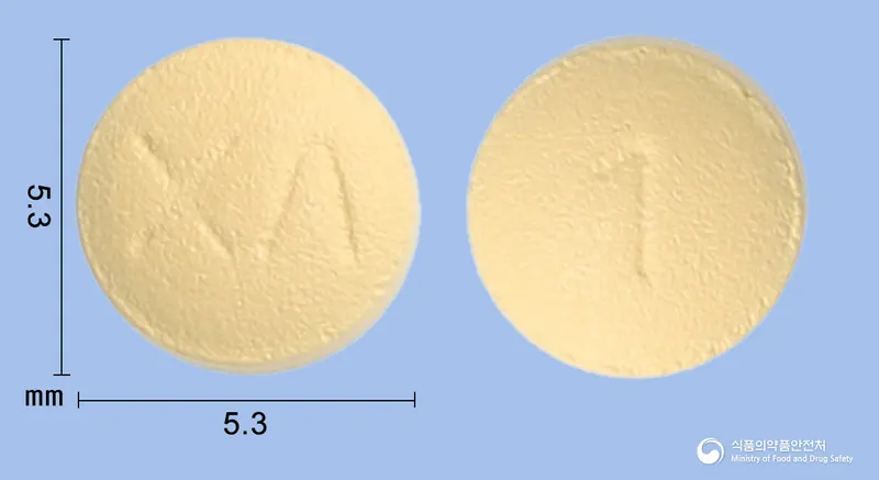 엘사정2.5mg(아픽사반(미분화)) 앞뒤 사진 (주황색 원형, 각인 XΛ / 1)