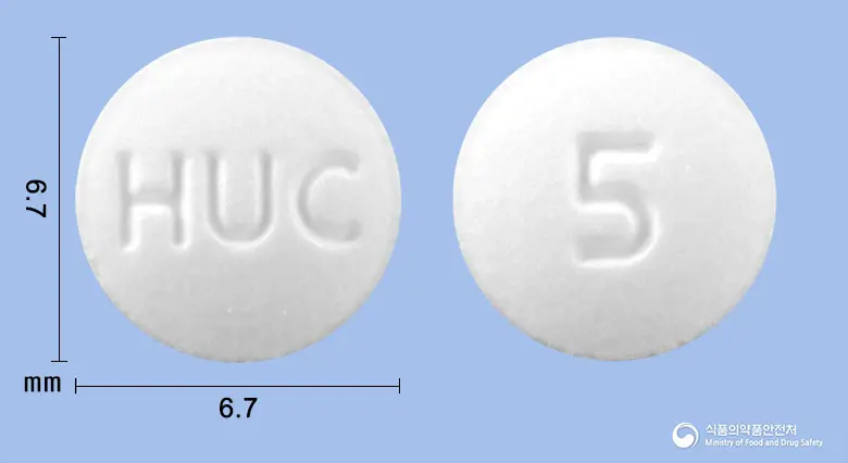 휴팔몬정(리마프로스트알파덱스) 앞뒤 사진 (흰색 원형, 각인 HUC / 5)
