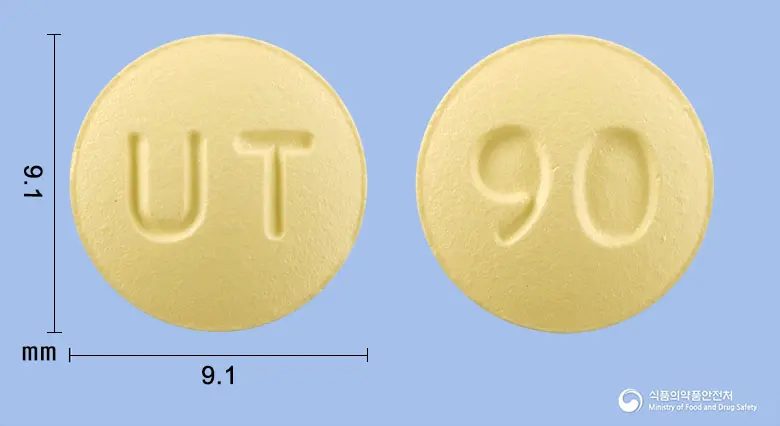 티글러정90밀리그램(티카그렐러) 앞뒤 사진 (노란색 원형, 각인 UT / 90)