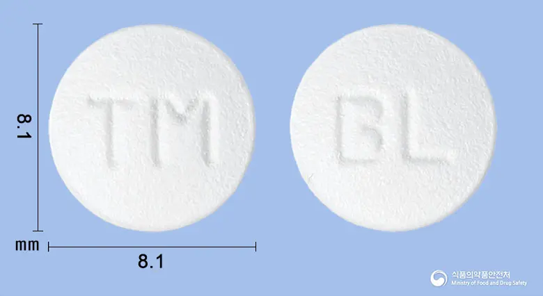 비엘티로미정100mg(티로프라미드염산염) 앞뒤 사진 (흰색 원형, 각인 TM / BL)