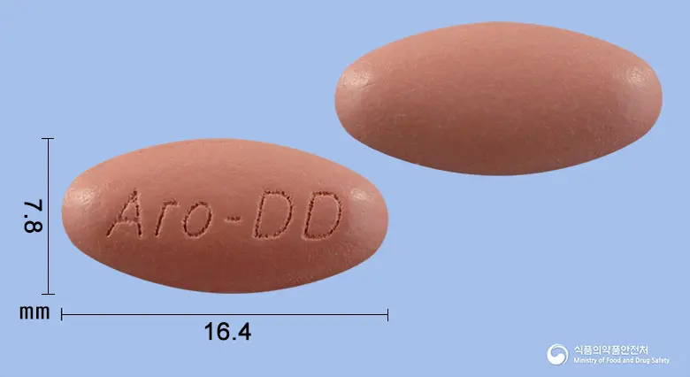 아로나민케어리피정 앞뒤 사진 (분홍색 타원형, 각인 Aro-DD)