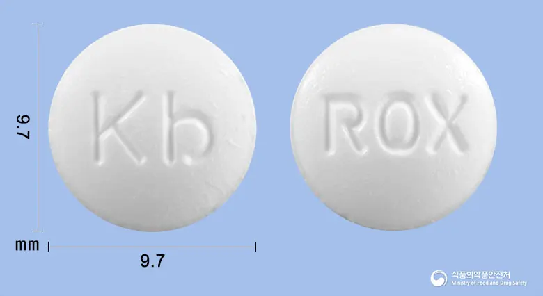 록시칸정(록시트로마이신) 앞뒤 사진 (흰색 원형, 각인 Kb / ROX)