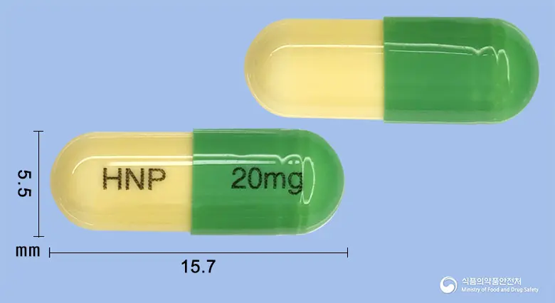 디프세틴캡슐20밀리그램(플루옥세틴염산염) 앞뒤 사진 (연두색 캡슐, 각인 HNP 20mg)