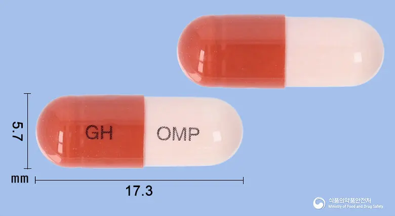 오메다캡슐(오메프라졸) 앞뒤 사진 (빨간색 캡슐, 각인 GH OMP)