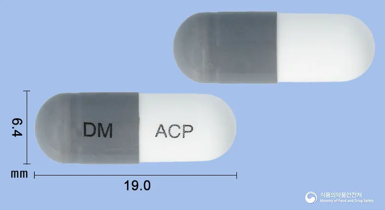 아세포린캡슐100밀리그램(아세브로필린) 앞뒤 사진 (회색 캡슐, 각인 DM ACP)