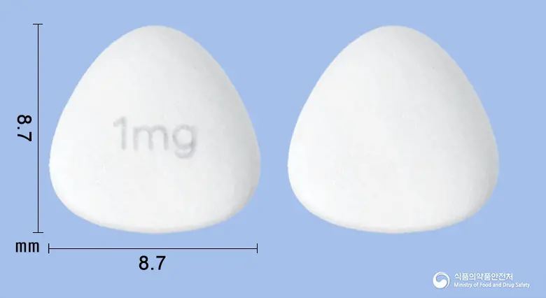 라파로벨정1밀리그램(시롤리무스) 앞뒤 사진 (흰색 삼각형, 각인 1mg)