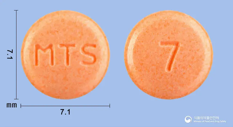 옥틸로엠정40mg(옥틸로늄브롬화물) 앞뒤 사진 (분홍색 원형, 각인 MTS / 7)