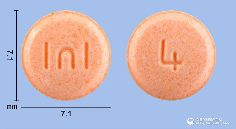 마티란정40mg(옥틸로늄브롬화물) 앞뒤 사진 (분홍색 원형, 각인 I∩I / 4)