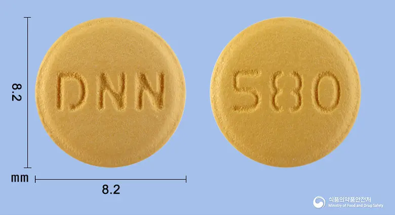 엑스발사텍정5/80mg 앞뒤 사진 (주황색 원형, 각인 DNN / 580)