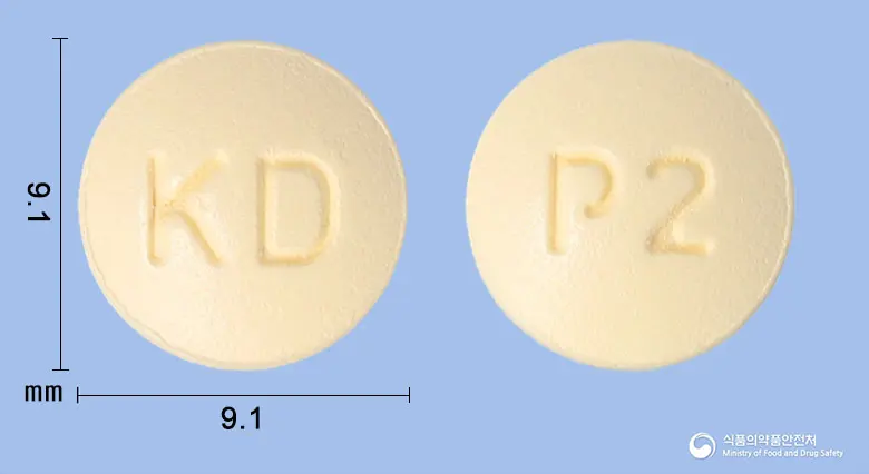 도네펨정10밀리그램(도네페질염산염수화물) 앞뒤 사진 (노란색 원형, 각인 KD / P2)