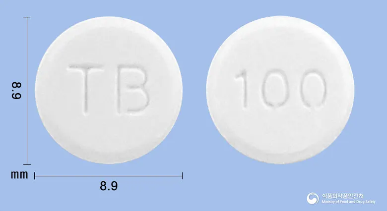 트리가정(트리메부틴말레산염) 앞뒤 사진 (흰색 원형, 각인 TB / 100)