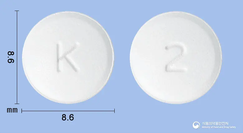 올메건정20밀리그램(올메사르탄메독소밀) 앞뒤 사진 (흰색 원형, 각인 K / 2)