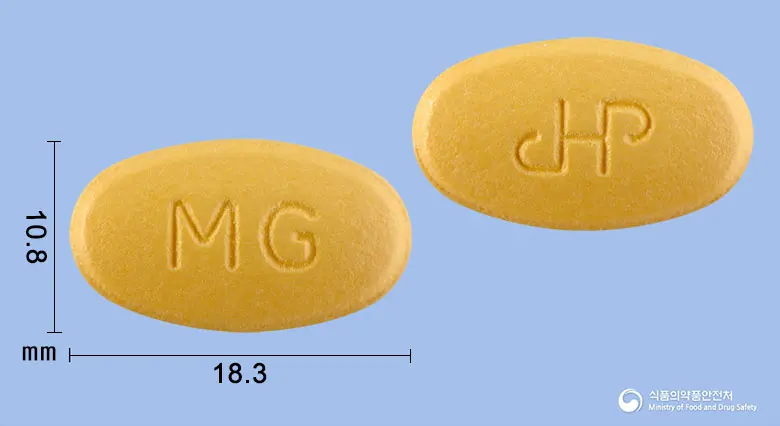 마그네스디정 앞뒤 사진 (주황색 타원형, 각인 MG)