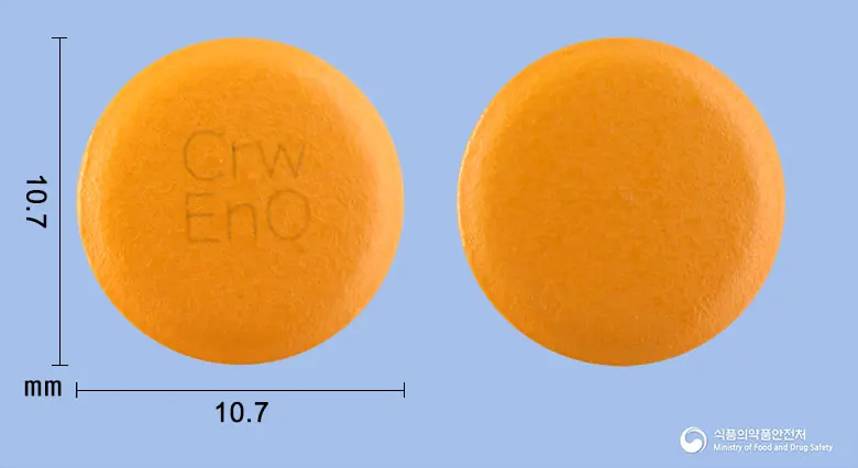 이엔큐플러스정 앞뒤 사진 (주황색 원형, 각인 CrwEnQ)