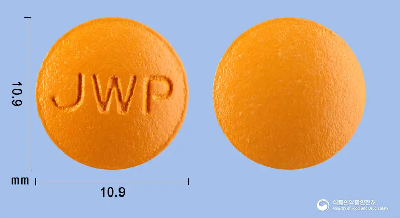 덴탈큐정 앞뒤 사진 (주황색 원형, 각인 JWP)
