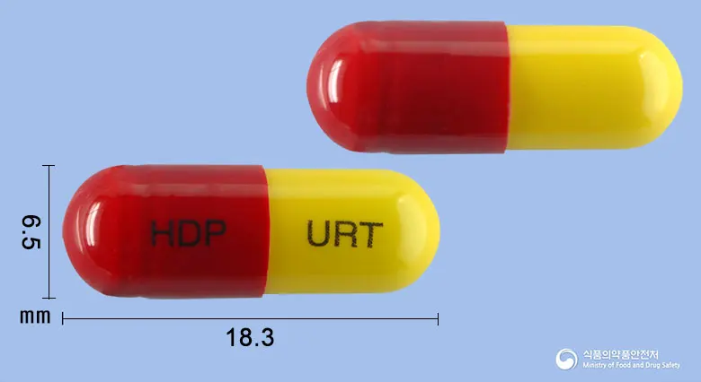 유린타민캡슐 앞뒤 사진 (빨간색 캡슐, 각인 HDP URT)