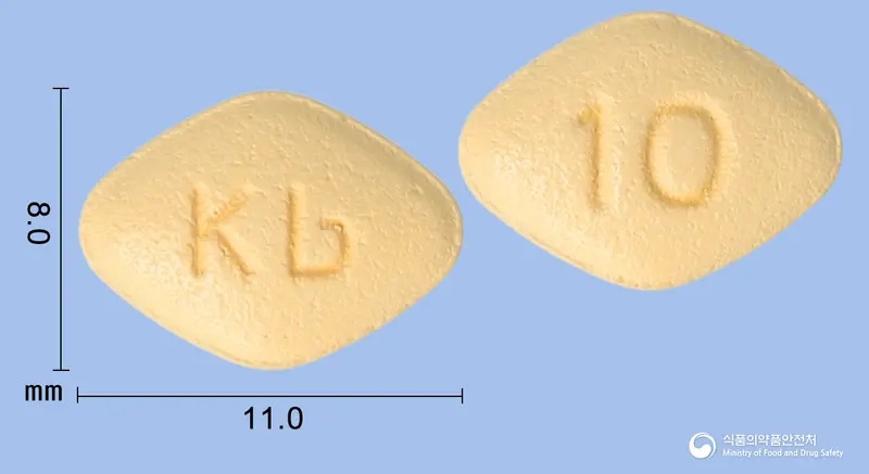 다파칸정10밀리그램(다파글리플로진무수유당혼합물) 앞뒤 사진 (주황색 마름모형, 각인 Kb / 10)