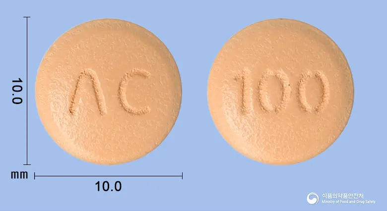 시타글민정100밀리그램(시타글립틴염산염수화물) 앞뒤 사진 (분홍색 원형, 각인 ΛC / 100)
