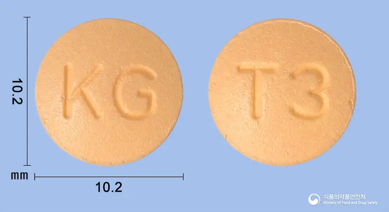 글로시타글정100밀리그램(시타글립틴염산염수화물) 앞뒤 사진 (주황색 원형, 각인 KG / T3)