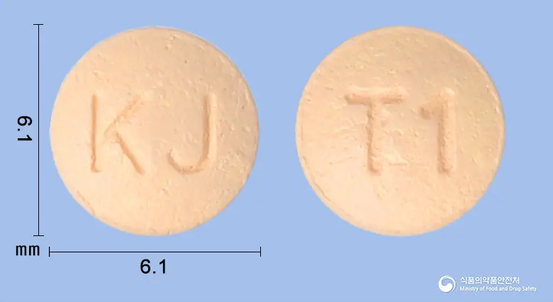 자누디정25밀리그램(시타글립틴염산염수화물) 앞뒤 사진 (분홍색 원형, 각인 KJ / T1)