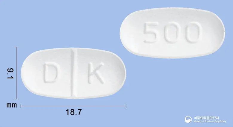 도베코정500밀리그램(도베실산칼슘수화물) 앞뒤 사진 (흰색 타원형, 각인 D K / 500)