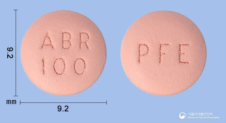 시빈코정100밀리그램(아브로시티닙) 앞뒤 사진 (분홍색 원형, 각인 ABR100 / PFE)