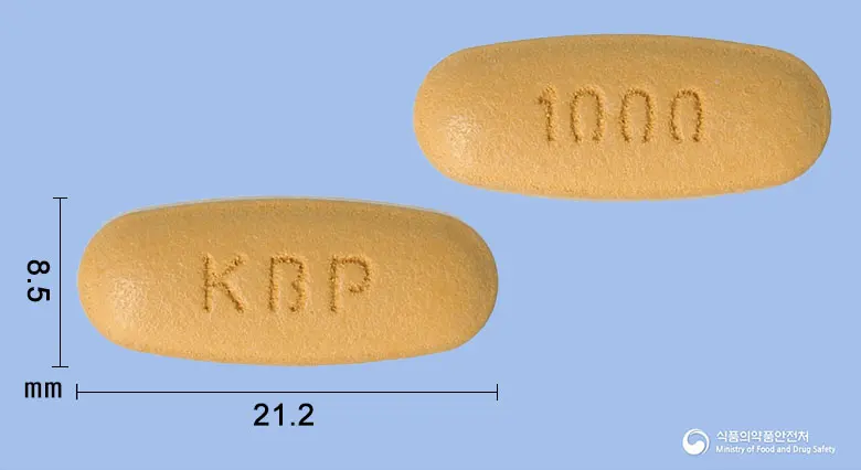 빌다메트정50/1000밀리그램 앞뒤 사진 (갈색 타원형, 각인 KBP / 1000)