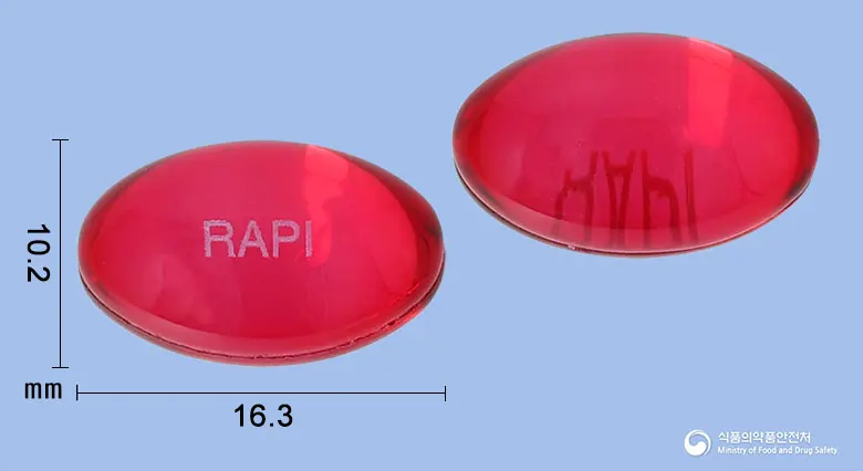 래피콜콜드연질캡슐 앞뒤 사진 (빨간색·투명 캡슐, 각인 RAPI)