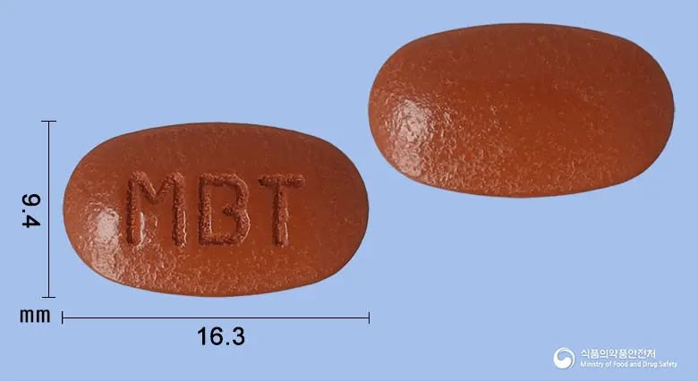 메코비정 앞뒤 사진 (갈색 타원형, 각인 MBT)