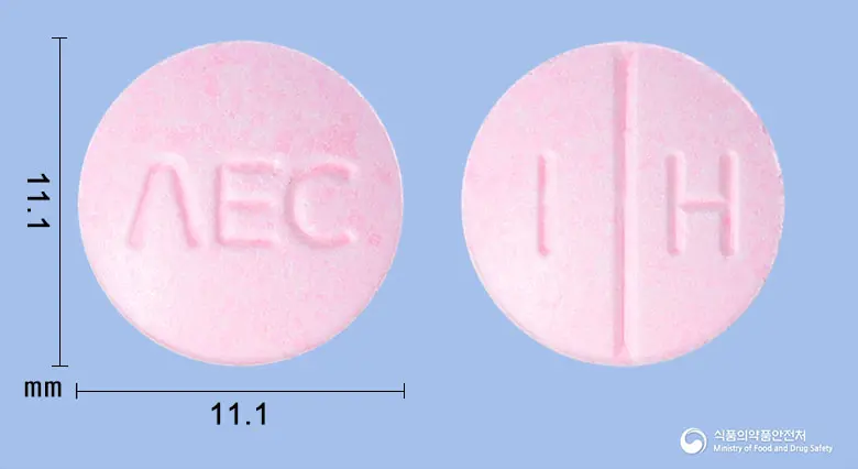 에리카정 앞뒤 사진 (분홍색 원형, 각인 ΛEC / I H)