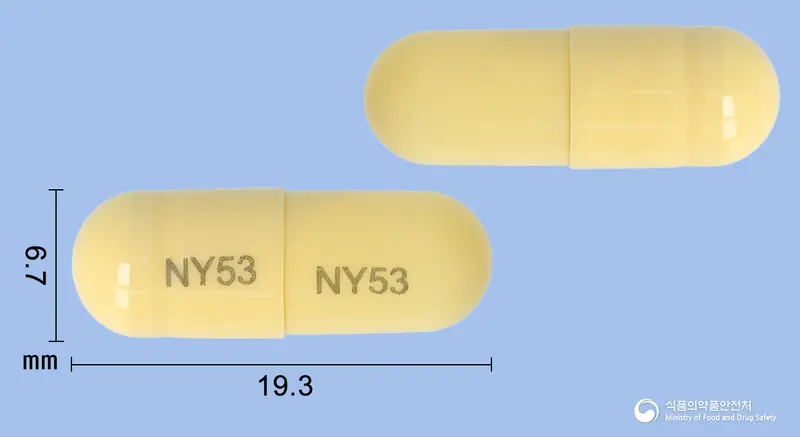 로페라신캡슐 앞뒤 사진 (노란색 캡슐, 각인 NY53 NY53)