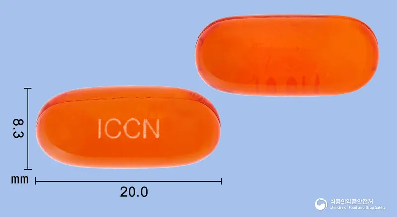 큐어코연질캡슐 앞뒤 사진 (주황색·투명 캡슐, 각인 ICCN)