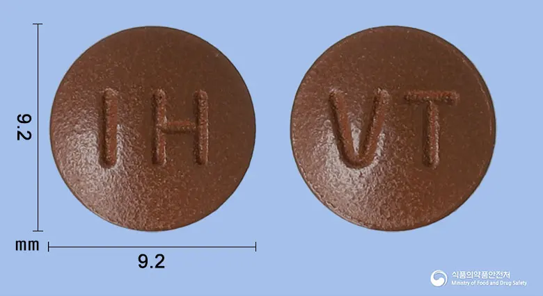 비아콘정 앞뒤 사진 (갈색 원형, 각인 IH / VT)