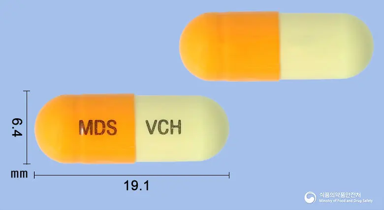 브이콜에이치캡슐 앞뒤 사진 (주황색 캡슐, 각인 MDS VCH)