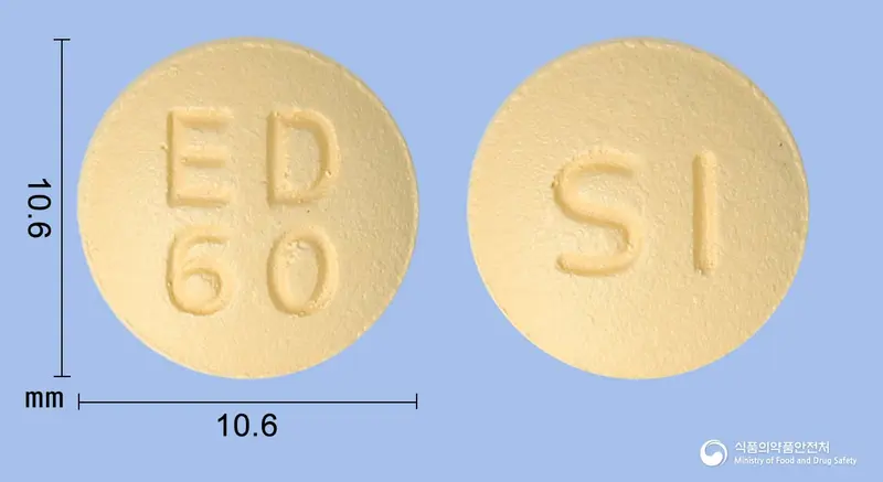 릭시사반정60밀리그램(에독사반토실산염수화물) 앞뒤 사진 (주황색 원형, 각인 ED60 / SI)