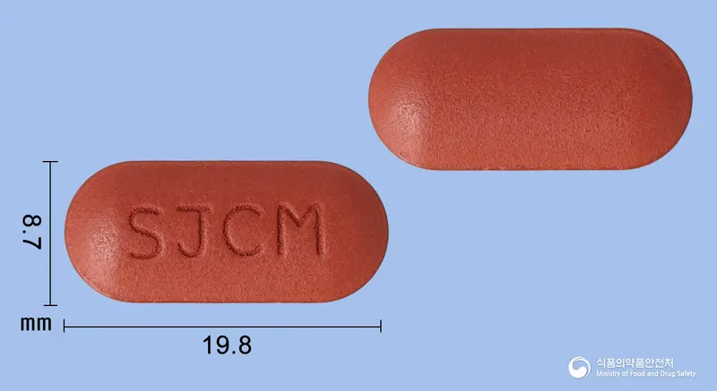 콘맥스정 앞뒤 사진 (갈색 장방형, 각인 SJCM)