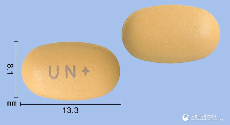 유니일라플러스정 앞뒤 사진 (주황색 타원형, 각인 UN+)