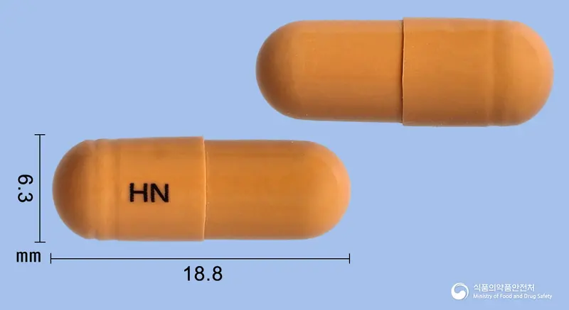 하나징코엠듀오캡슐 앞뒤 사진 (주황색 캡슐, 각인 HN)