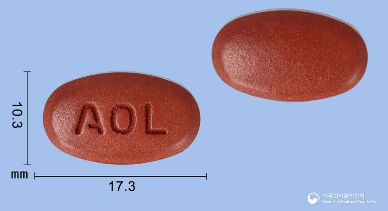 올대원골드정 앞뒤 사진 (갈색 타원형, 각인 AOL)