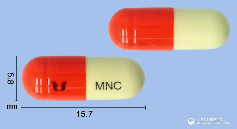 미노젠캡슐50밀리그램(미노사이클린염산염) 앞뒤 사진 (주황색 캡슐, 각인 MNC)