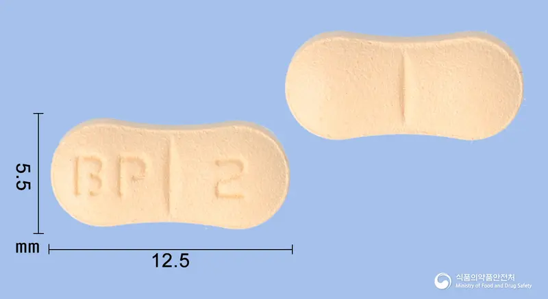 피엠에스메만틴정20mg(메만틴염산염) 앞뒤 사진 (주황색 기타, 각인 BP 2)